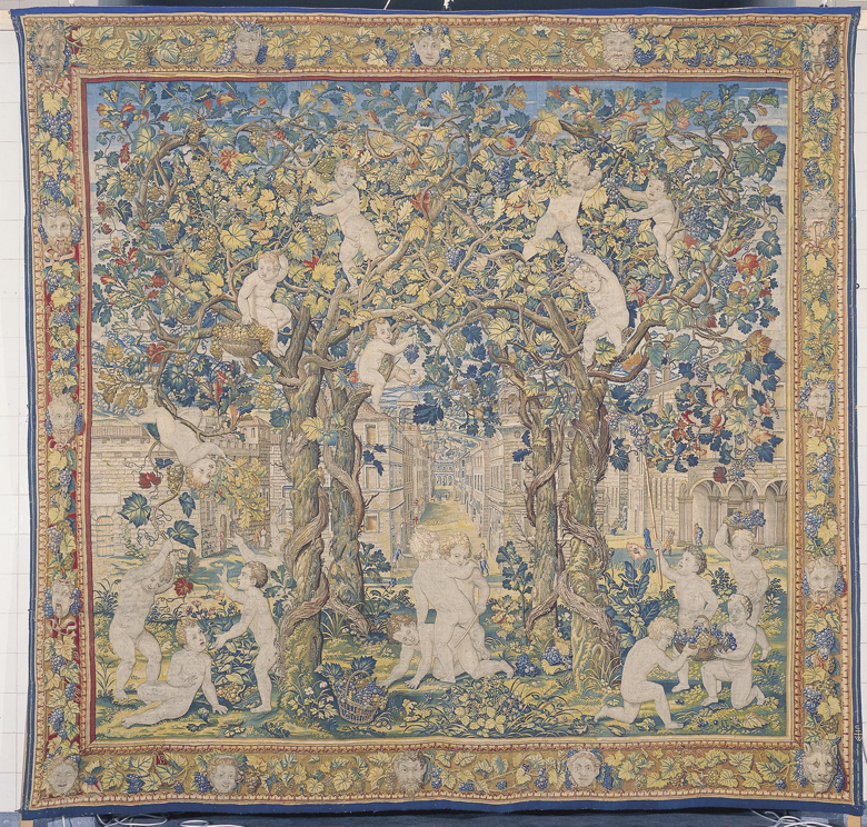 Emparrados y niños cogiendo uvas